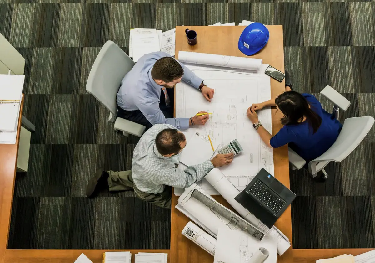 Project team reviewing construction plans